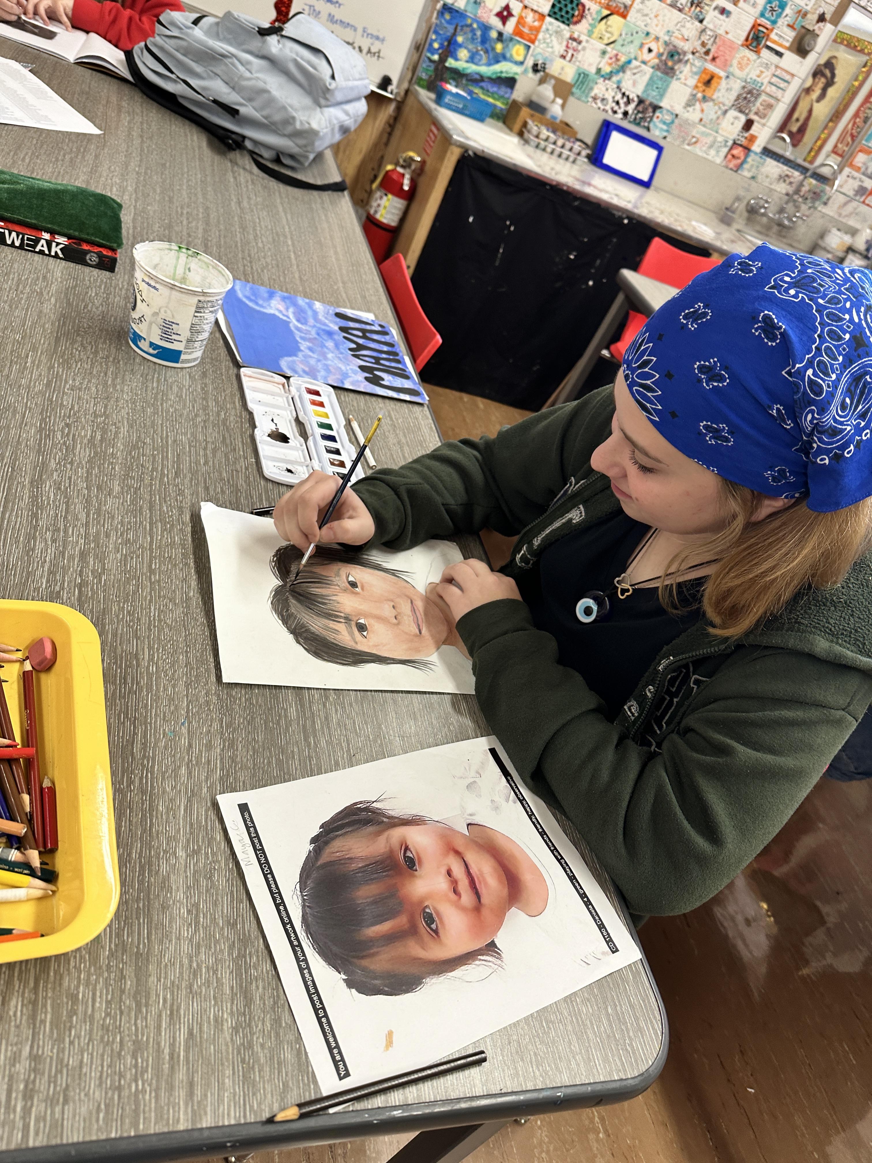 QHS student works on portrait